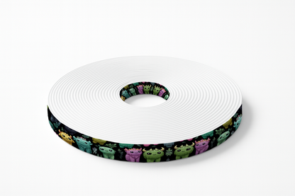 BioThane imprimé – Créatures mignonnes multicolores sur fond noir