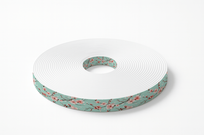 L'atelier du Fourmilier BioThane imprimé au mètre BioThane® imprimé – Fleurs de cerisier sur fond vert d'eau