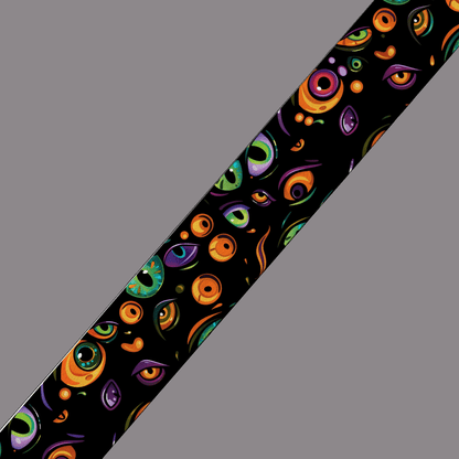 L'atelier du Fourmilier BioThane imprimé au mètre Motif BioThane imprimé UV – Yeux multicolores sur fond noir